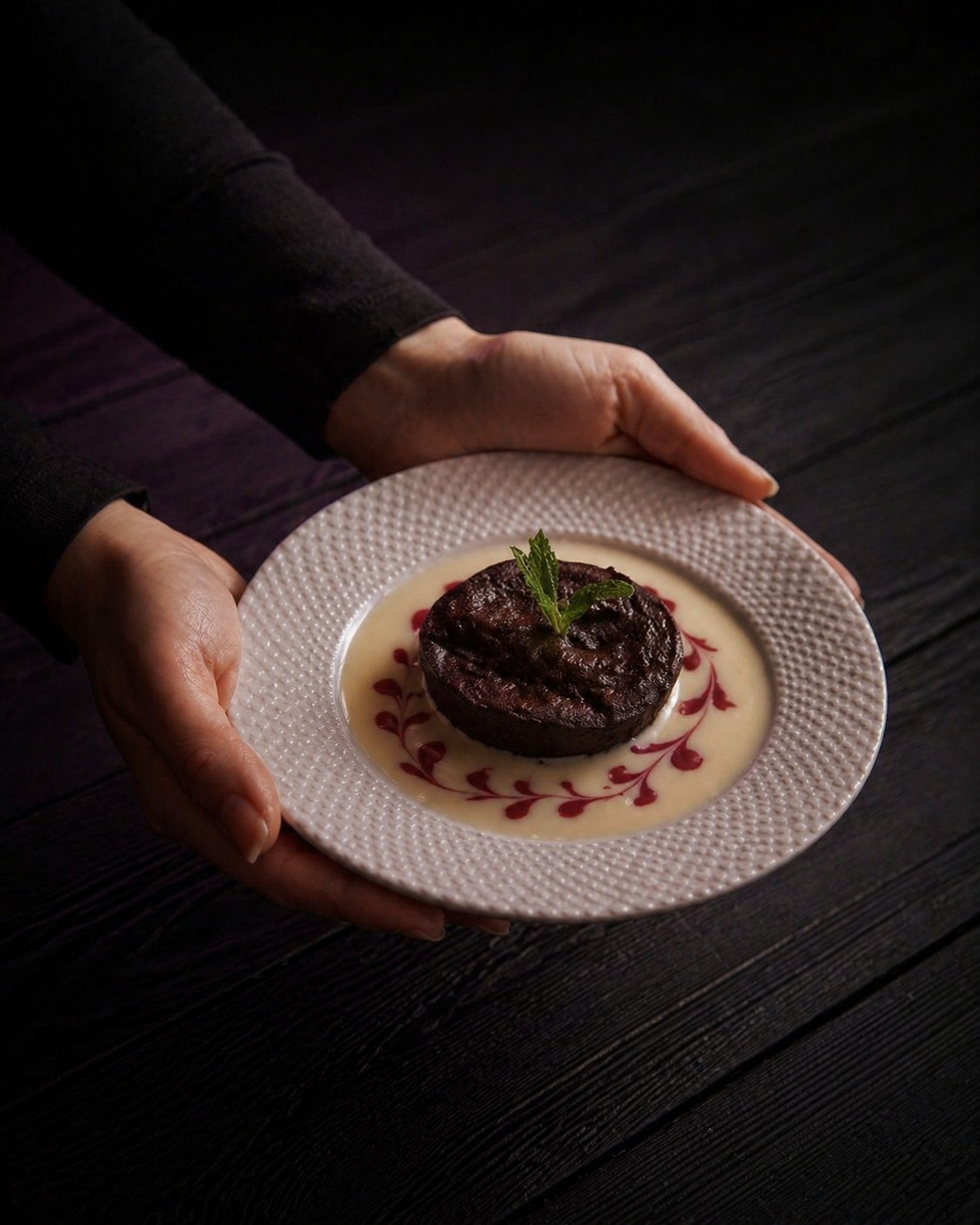 Chocolate dessert with crème anglaise plating